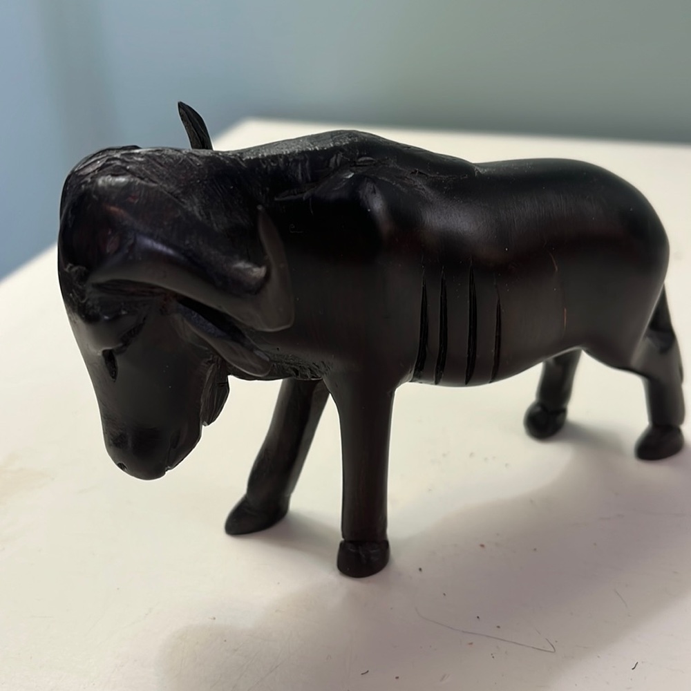 Small wooden water buffalo carving.